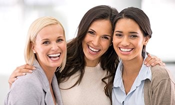 three women smiling