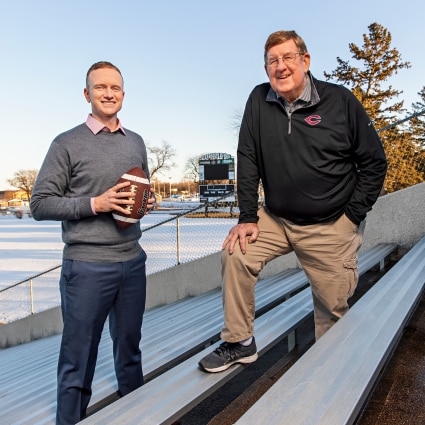 Dr. Travers with coach in stands