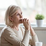 woman with coffee thinking