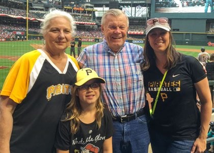 April and John Sampson with daughter Kori and grandchild