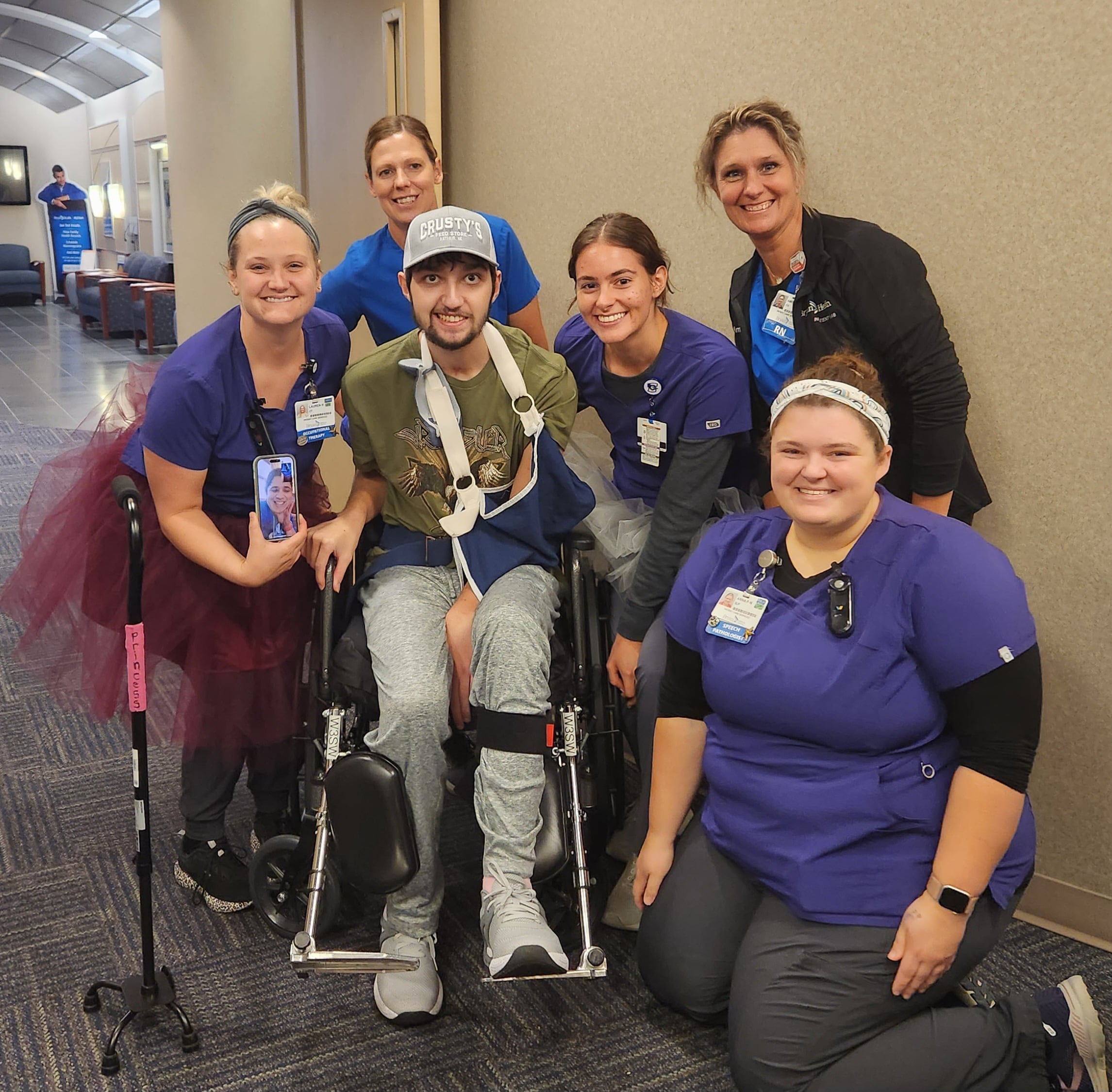 Corbin w/ Rehab Team in Wheelchair