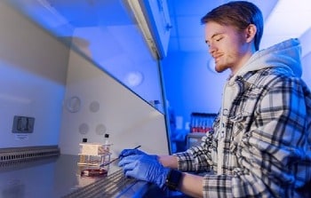 student in health sciences lab